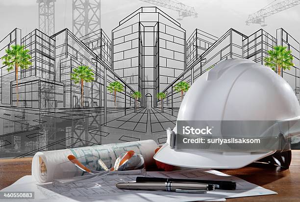 Safety Helmet And Paper Working Plan Of Architecture Stock Photo - Download Image Now