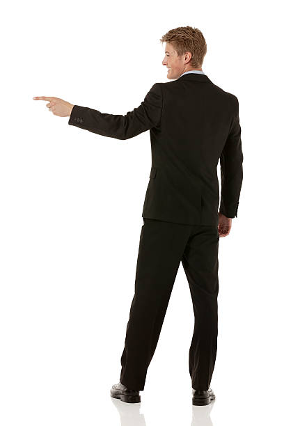 istock Businessman pointing at his side back view 460551545