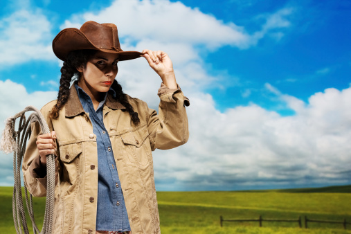 Cowgirl standing with lasso on shoulderhttp://www.twodozendesign.info/i/1.png