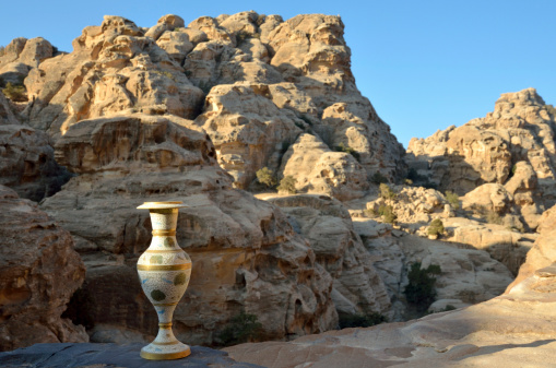 Ancient arab jug and Little Petra landscape, Jordan.
