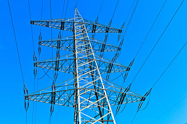 istock Steel electricity pylon on bright blue sky 460554747