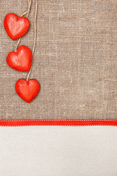 istock Valentine card with red hearts and ribbon 460570939