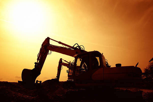 istock earth mover buldozer silhouette again sunest light 460581995