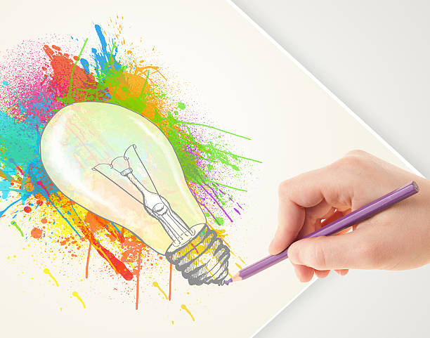 istock Hand drawing on paper a colorful splatter lightbulb 460583633