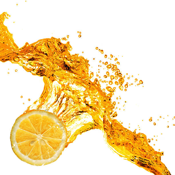 istock orange slice and splash of juice isolated on white 460585115
