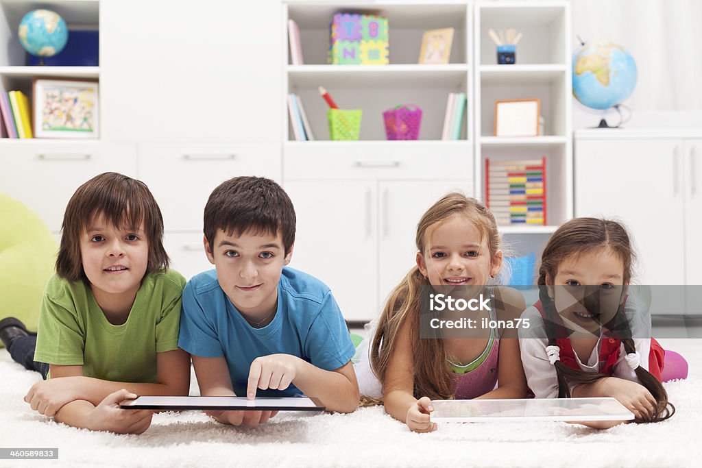 Happy kids with tablet computers Happy kids using tablet computers Boys Stock Photo