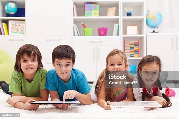 Happy Kids With Tablet Computers Stock Photo - Download Image Now - Boys, Cheerful, Child