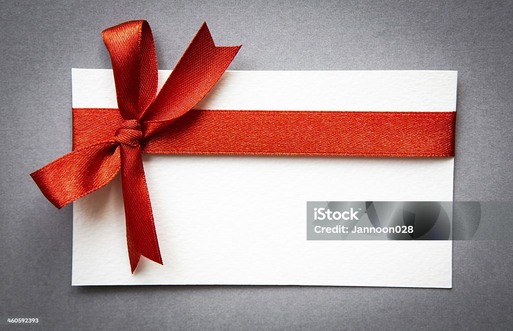 Card with red ribbons bows Coupon Stock Photo