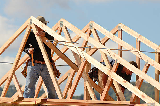 istock Men constructing roof rafters with wood 460592655