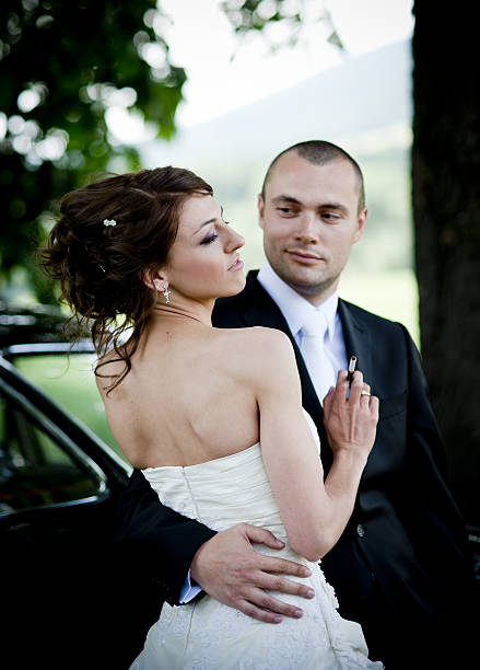 istock Bride and groom in car 460594059