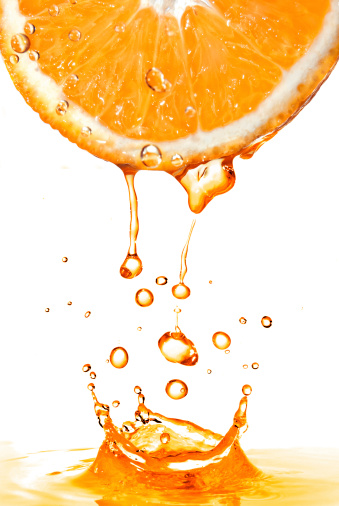 Juice splash on orange isolated on white