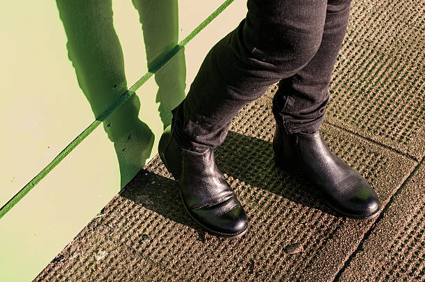 istock Black trousers and ladies vintage boots 460594901