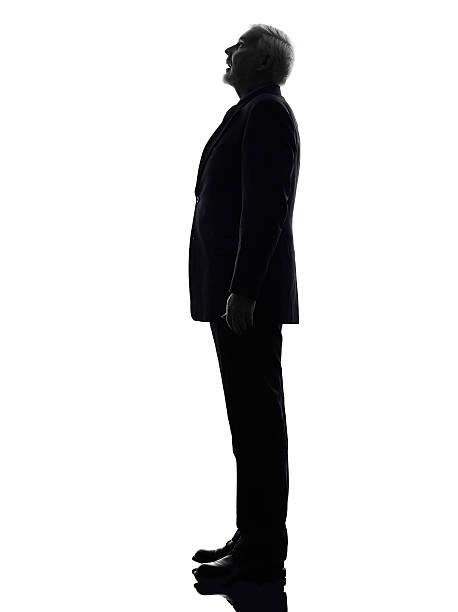 istock senior business man surprised looking up silhouette 460607089