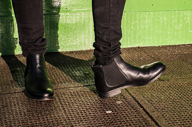 istock Black trousers and ladies vintage boots 460619421