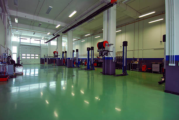 istock An empty repairs garage with green floor 460638261