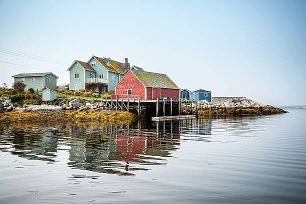 Typical Houses of Nova Scotia, Canada Typical colorful houses at an old fishing village. Peggy's Cove. Nova Scotia, Canada. peggys cove stock pictures, royalty-free photos & images