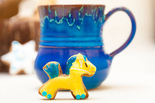 istock Blue mug and christmas gingerbread cake pony icing decoration 460641981