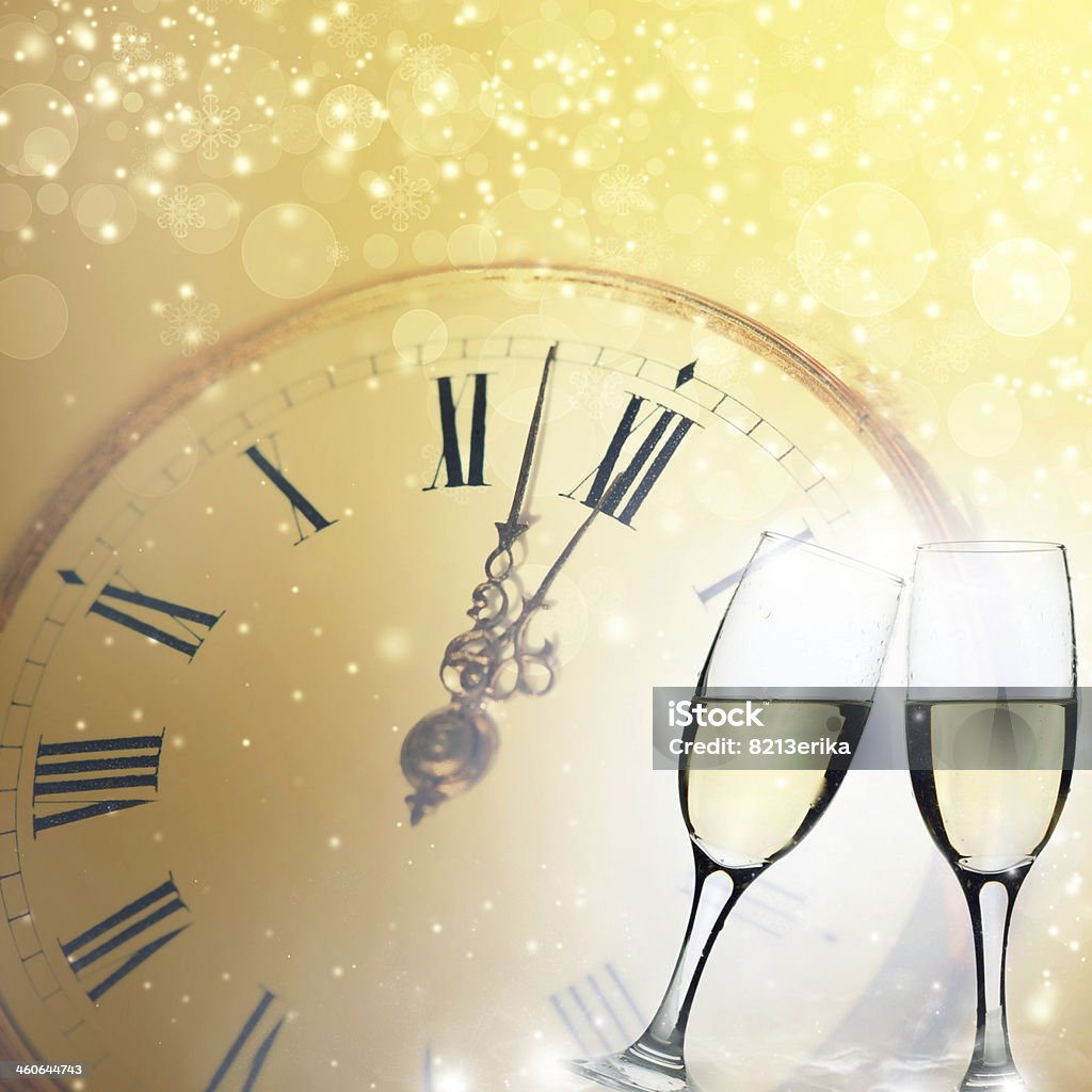 Glasses with champagne and clock close to midnight Glasses with champagne against clock and holiday background 12 O'Clock Stock Photo