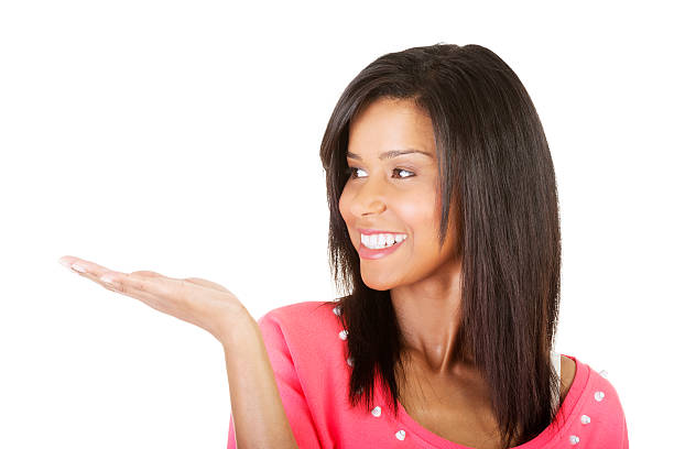 istock Happy , excited young woman presenting copy space on her palm 460655275
