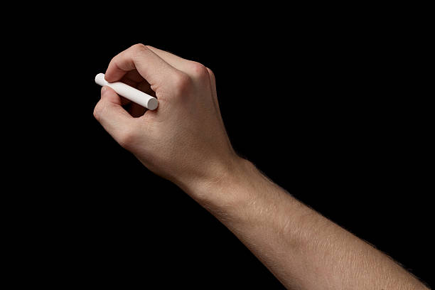istock adult man hand with chalk to write something 460658113