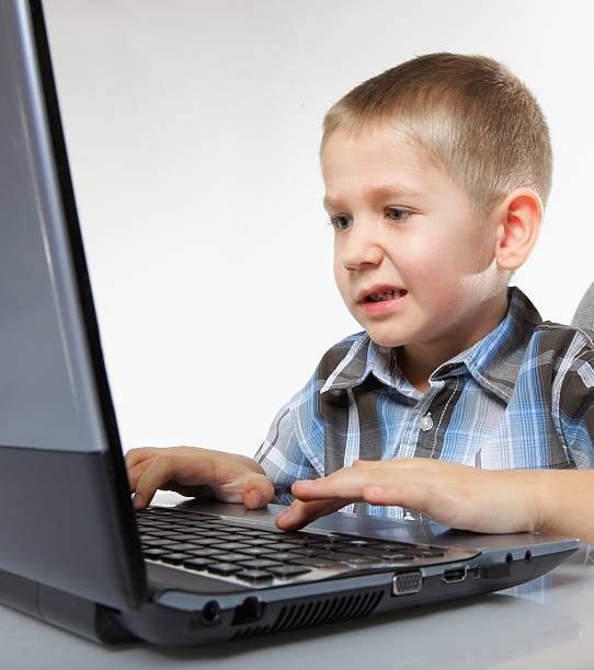 istock Computer addiction emotional boy with laptop 460661487