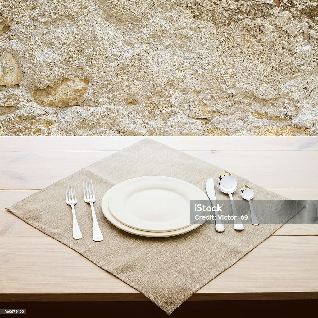 tableware for dinner plates and forks tableware for dinner - plates and forks on wooden table surface Banquet Stock Photo