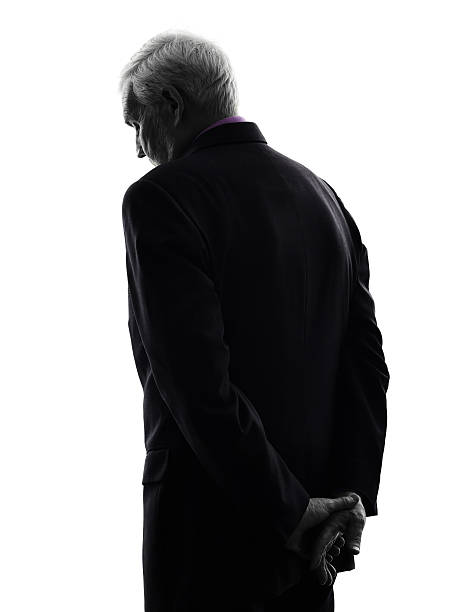 istock senior business man sad rear view silhouette 460681993