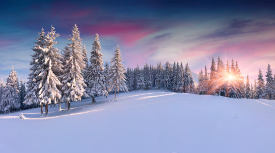 Panorama of the winter sunrise in the mountains