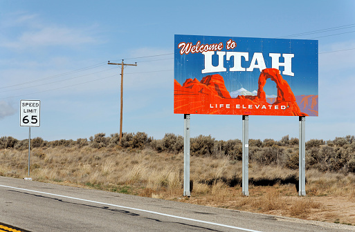Monticello, Utah, USA – October 23, 2012: A welcome sign marks the state line between Utah and Colorado on US 491. Utah became the 45th state admitted to the Union on January 4, 1896.