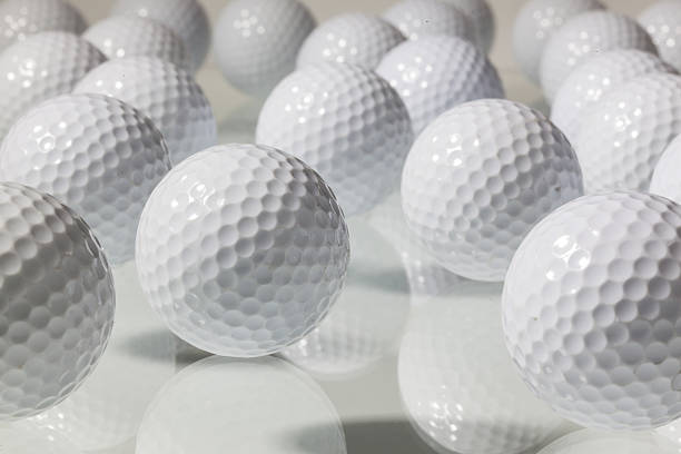 istock Many golf balls on a glass table 460684301
