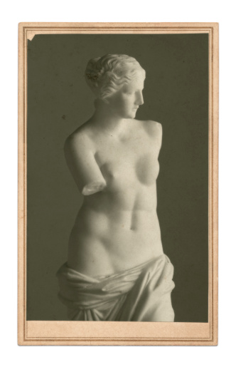 Vintage copy of celebrated Venus de Milo - a famous Greek sculpture dating back to about 100 BC, discovered in 1820 on the Aegean island of Milos - here in the style of a vintage photo (my own) on white. Layered on old paper with added grain and other vintage effects.