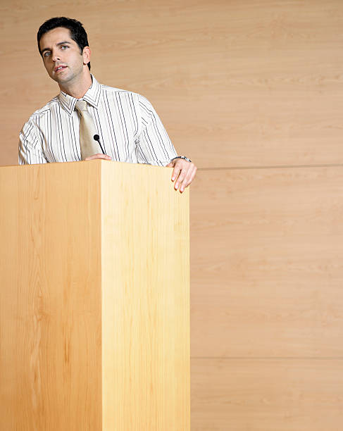 istock Businessman Talking At Podium 460689997