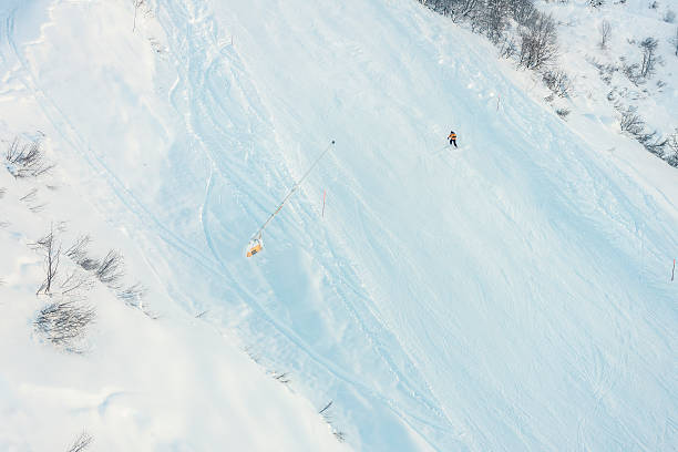 Man skiing in Alagna, Monte Rosa, Italy Alagna, Italy - December 27, 2013: A man skiing down a slope in Alagna, on the Monte Rosa mountain, Italian side. roberto alagna stock pictures, royalty-free photos & images