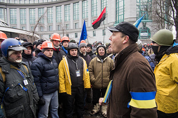 Anti-Government Protest in Ukraine Kiev, Ukraine- December 7, 2013: protestors gathers in the street of kiev. Protesters took to the streets following President Yanukovics refusal to sign a deal with the European Union. riot police stock pictures, royalty-free photos & images