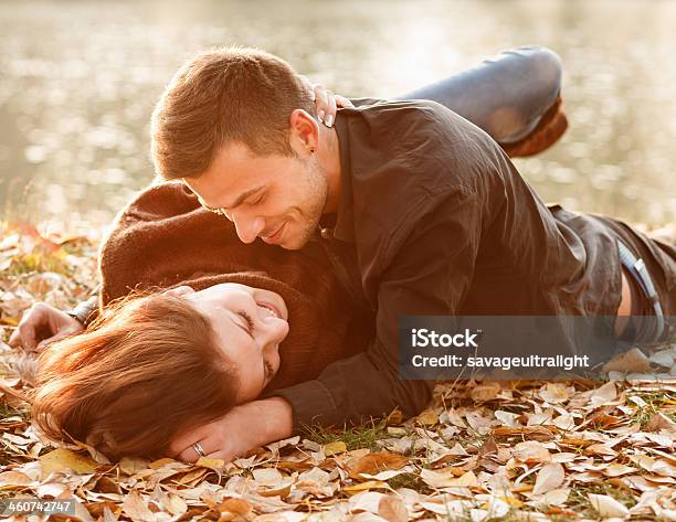 Young Couple Lying Down Smiling Stock Photo - Download Image Now - 20-29 Years, Adult, Boyfriend