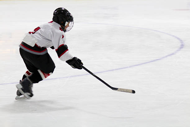 istock Child playing minor hockey 460743297