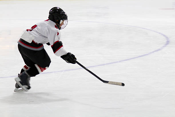 Child playing minor hockey stock photo