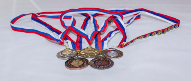 Photo received medals for prize places, arranged in the form . rings.