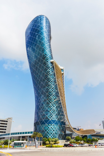 ABU DHABI, UAE - NOVEMBER 5: The Capital Gate Tower on the November 5, 2013 in Abu Dhabi, This is certified as the World's Furthest Leaning Manmade in the world. it is in the heart of the business area.