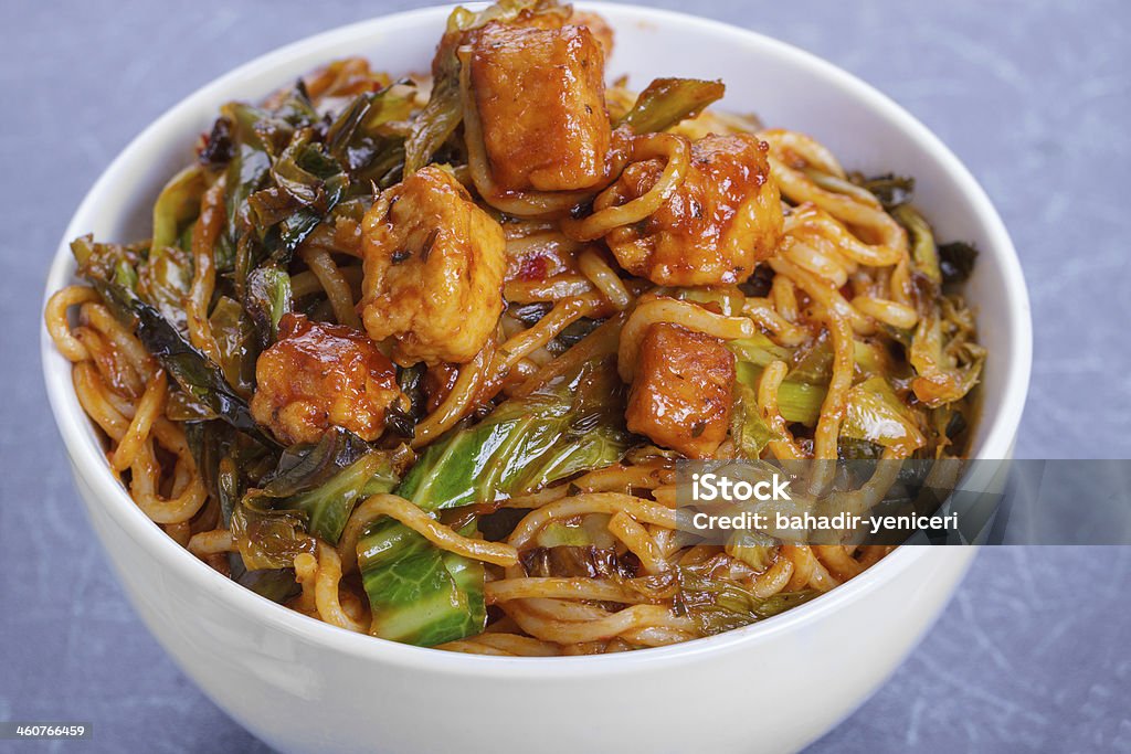 Chicken Noodles Close Up Noodles with Szechuan Tomato Sauce, Chicken and Vegetables Appetizer Stock Photo