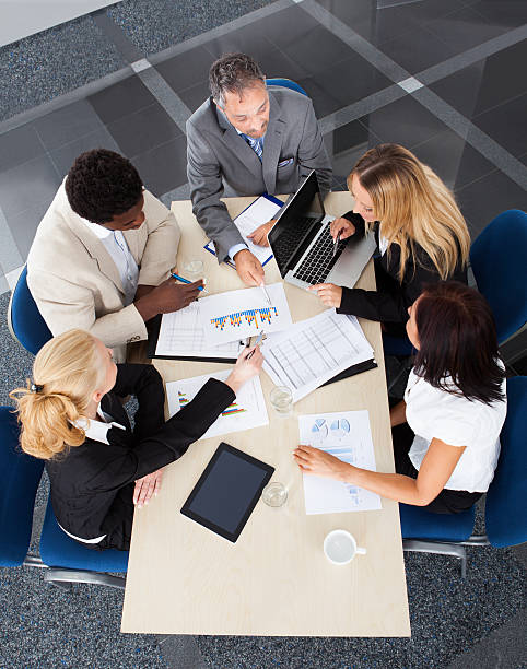 istock Group Of Businesspeople Discussing Together 460766883