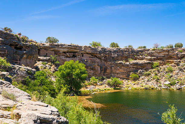 Montezuma Well in Arizona, USA Montezuma Well is part of Montezuma Castle National Monument in Arizona, USA. Ancient cliff dwelling is visible on the left side of the photograph. puebloan peoples stock pictures, royalty-free photos & images