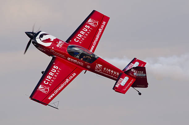 Nigel Hopkins knife edge Pretoria, South Africa -MAy 11, 2013 - Nigel Hopkins in a MX2 doing a knife edge during the Time Aviation SAAF Museum Airshow  at Swartkop Airforce Base stunt airplane airshow air vehicle stock pictures, royalty-free photos & images