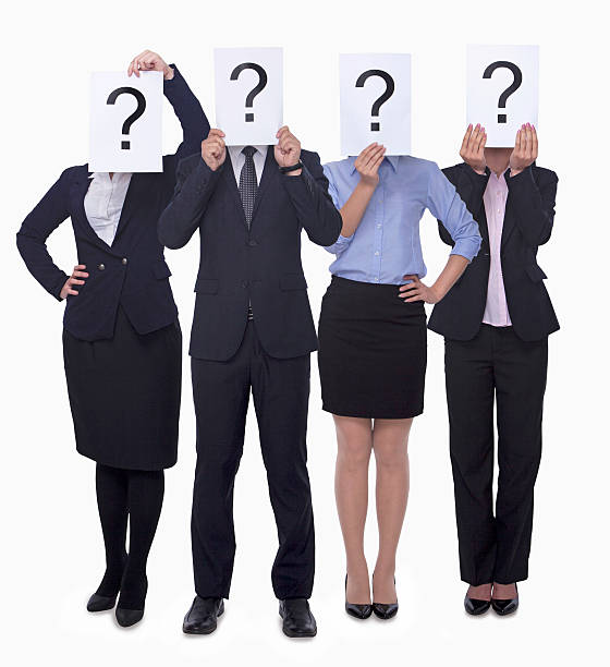 istock Business people holding questions marks over their faces 460773163
