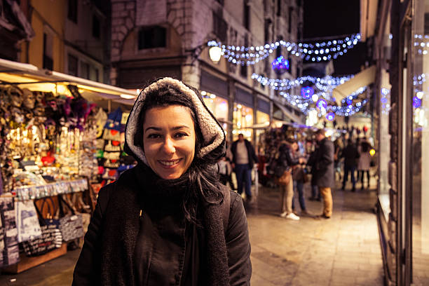istock Young woman smiling in Venice streets 460774281