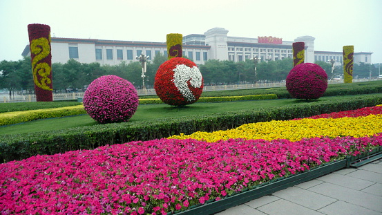 Beijing, China – May 25, 2012: Flower decorations at Tiananmen Square.  Tiananmen Square (Gate of Heavenly Peace) is a main tourist destination in Beijing, China.