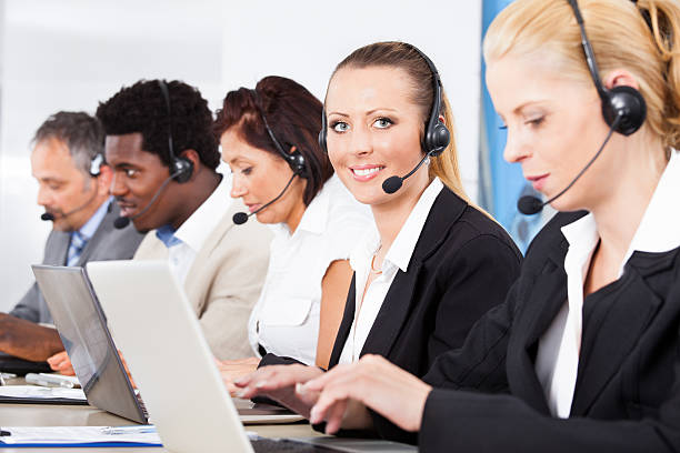 istock Beautiful Young Woman Talking On Headset 460779109
