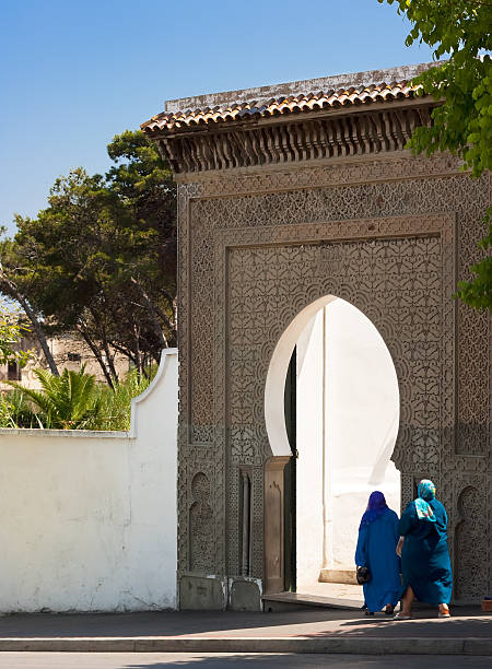 Maroccan man wearing jellaba, medina Fes. Fez is the second largest city of Morocco, and is a UNESCO World Heritage Site. The city has been called the \
