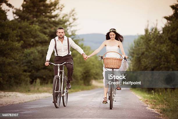 Bride And Groom On The Bikes Stock Photo - Download Image Now - Cycling, Bicycle, Bride