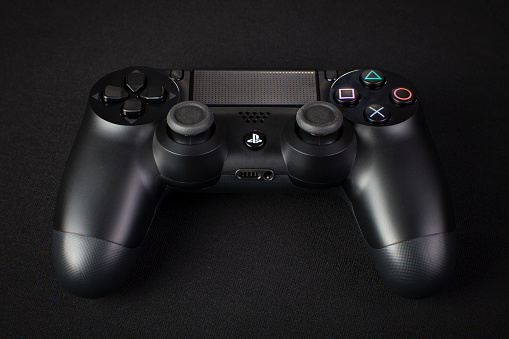 Wrocław, Poland - December 29, 2013:  A controller for the PlayStation 4. The PS4 is a video gaming console produced by Sony Computer Entertainment.